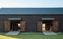 Four pairs of large barn doors can be opened to allow air to flow through the barn.